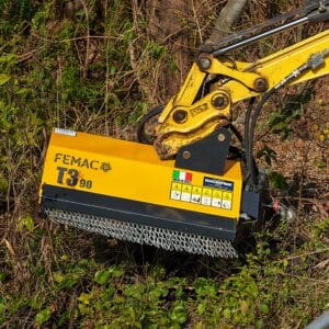 FEMAC T3-90 Excavator Mulcher reaching over fence to clear vegetation