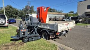 Slanetrac HT1000 Dumper pouring load into truck