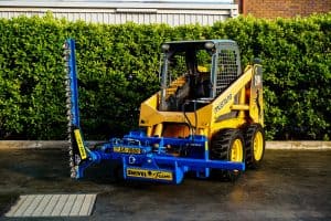 Slanetrac SA1000 hedge trimmer attachment on Skid Steer Loader