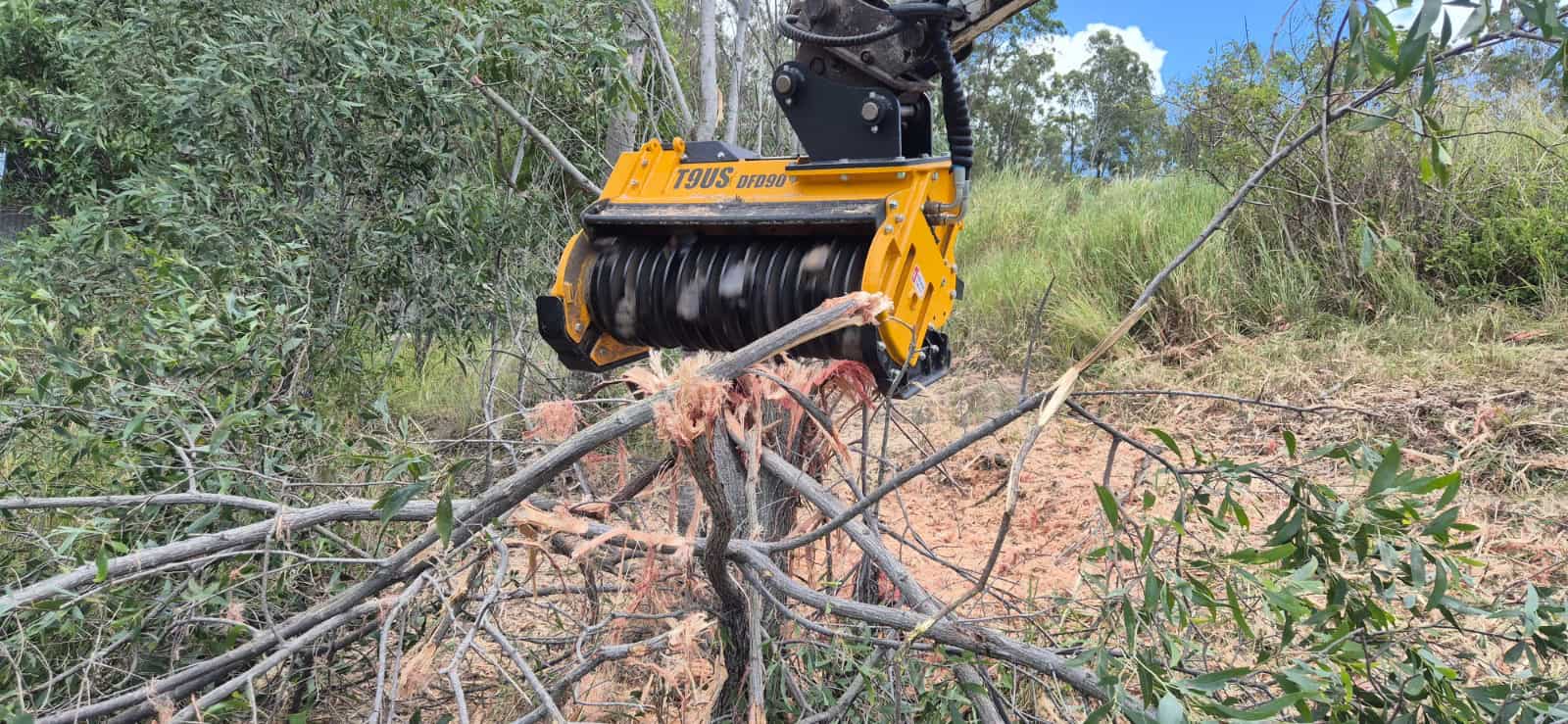 FEMAC T9US Forestry mulcher mulching a wattle bush in Australia